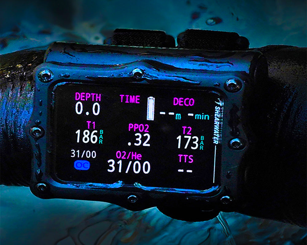 Shearwater Perdix 3 dive computer on a diver wrist with bright AMOLED display underwater